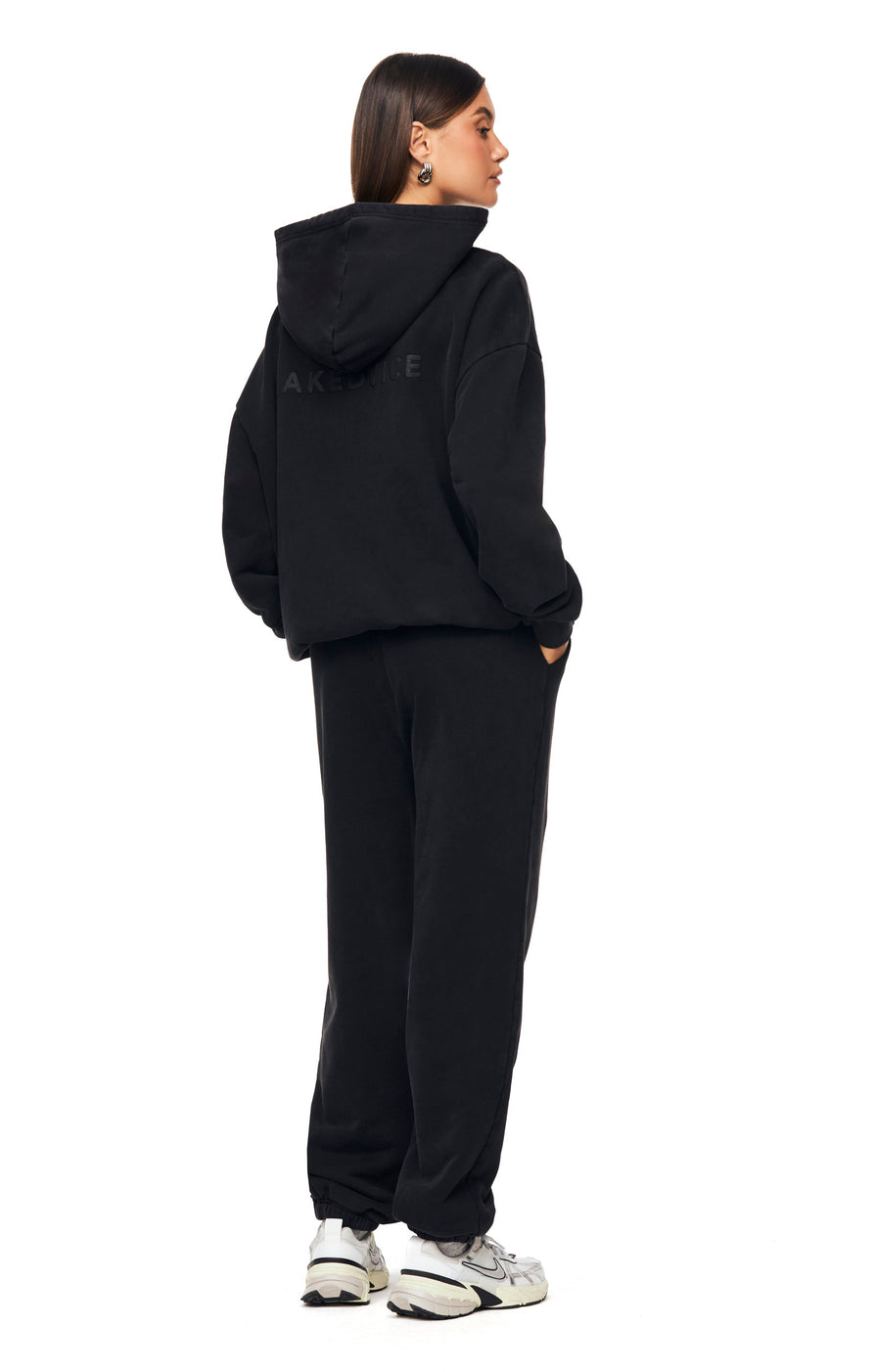 THE UNISEX WASHED BLACK HOODIE | model